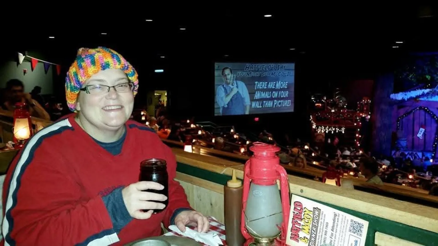 Lisa smiling during an evening out at a dinner show