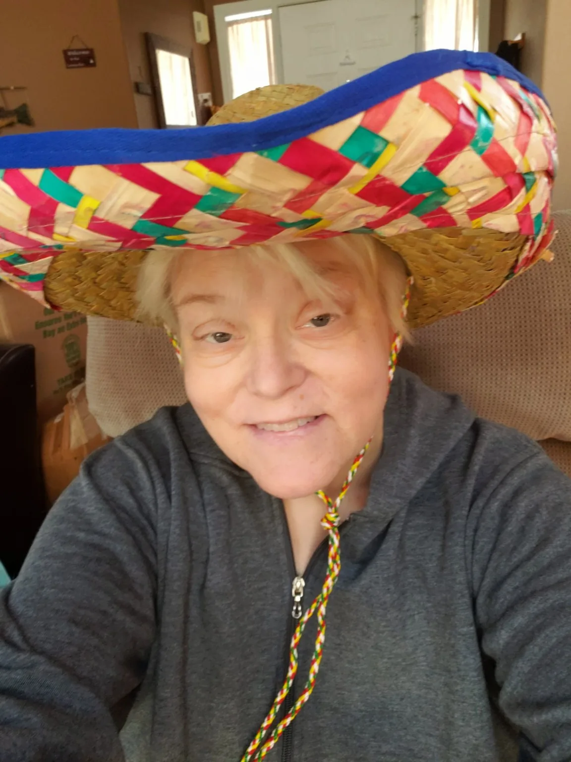 Lisa smiling in a colorful sombrero